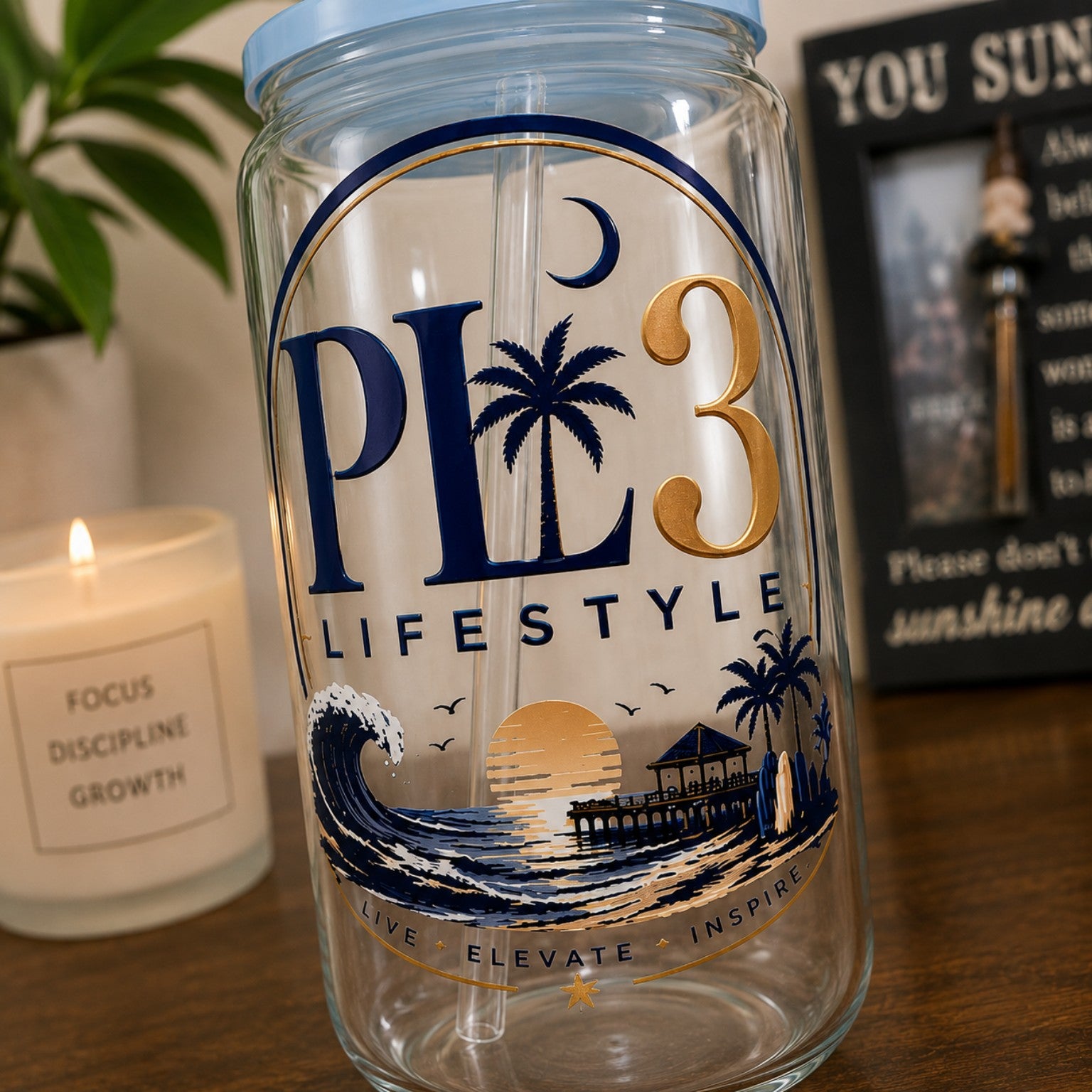 Close-up of the PL3 Lifestyle coastal design on a 16 ounce glass can cup